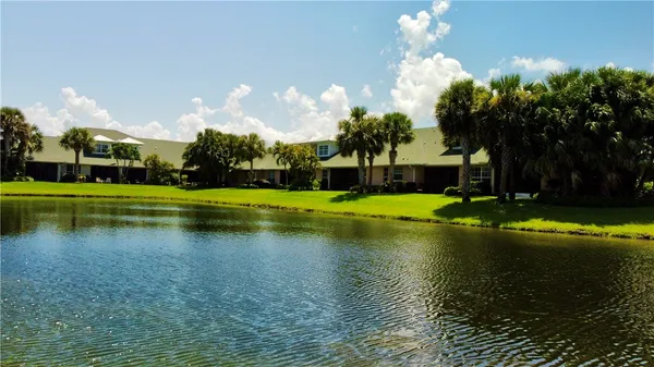a view of a swimming pool with a yard
