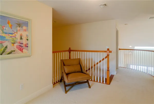 a view of a hallway with seating area