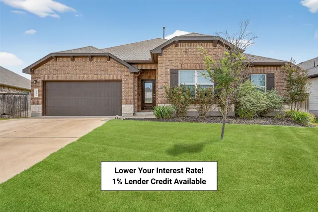 a sign board on the side of a big yard