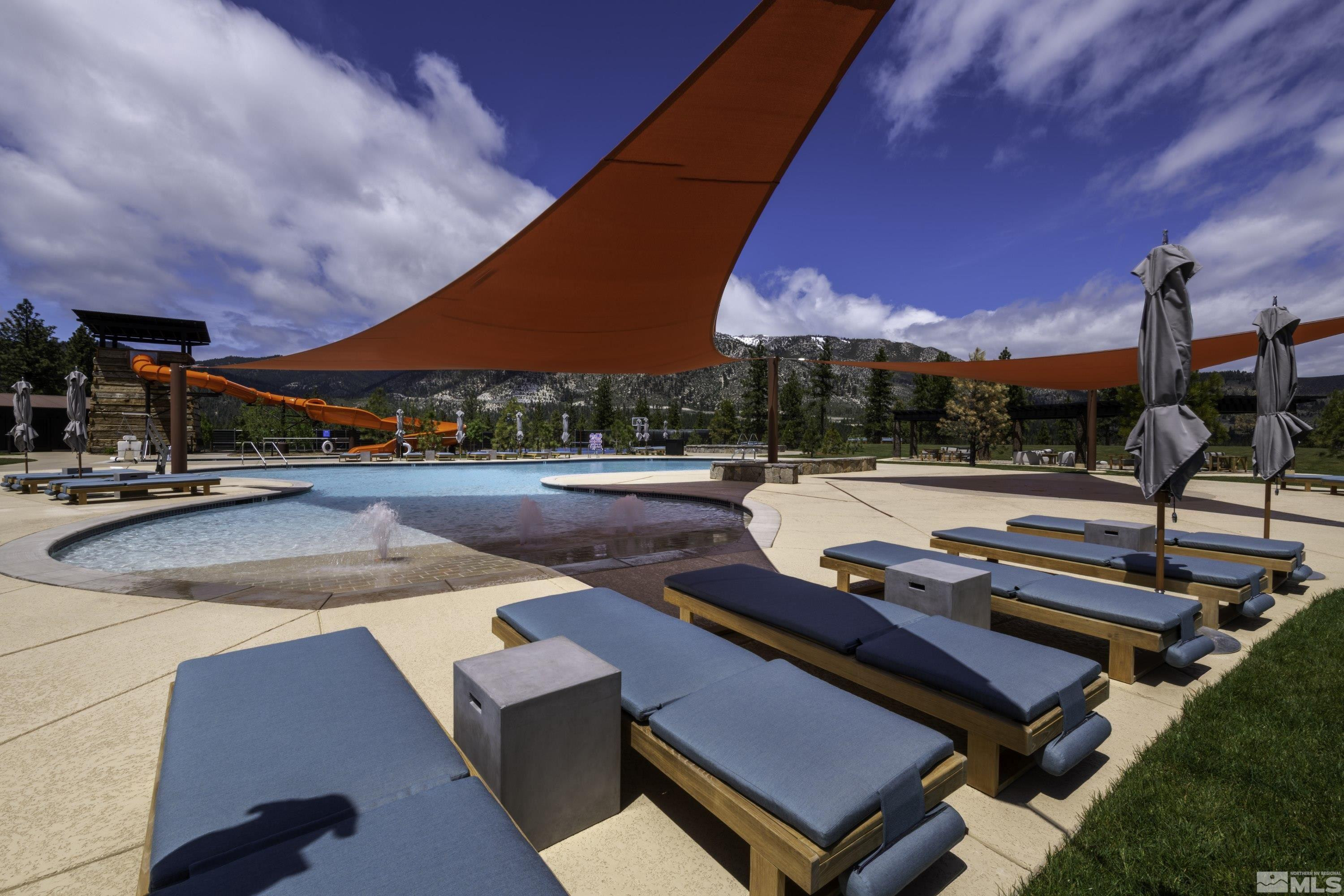 140 Walton Toll Road, Unit 179 Carson City, NV 89705 - Photo 23 of 39 a view of a patio with a table and chairs