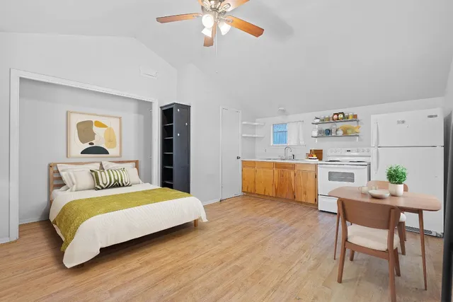 a bedroom with a bed and a table in it