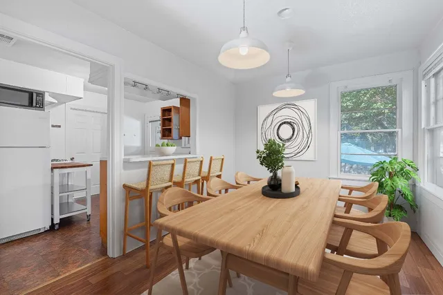 a dining room with furniture and window