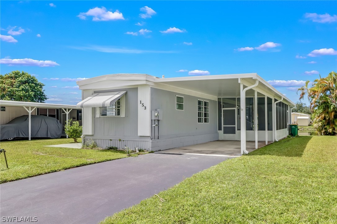 a view of a house with a yard