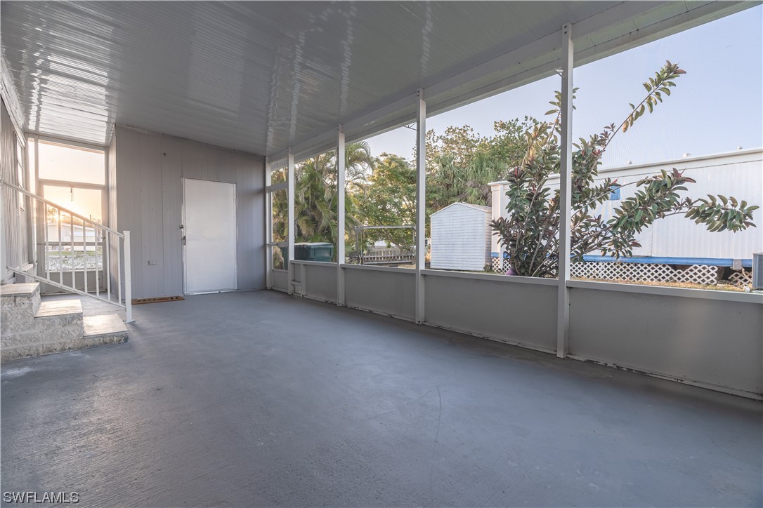 153 Cape Sable Drive Naples, FL 34104 - Photo 27 of 35 a view of an empty room with a large window