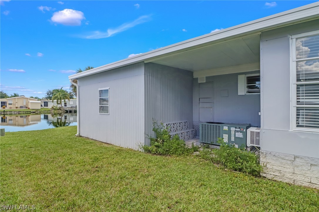 153 Cape Sable Drive Naples, FL 34104 - Photo 34 of 35 a house view with a garden space