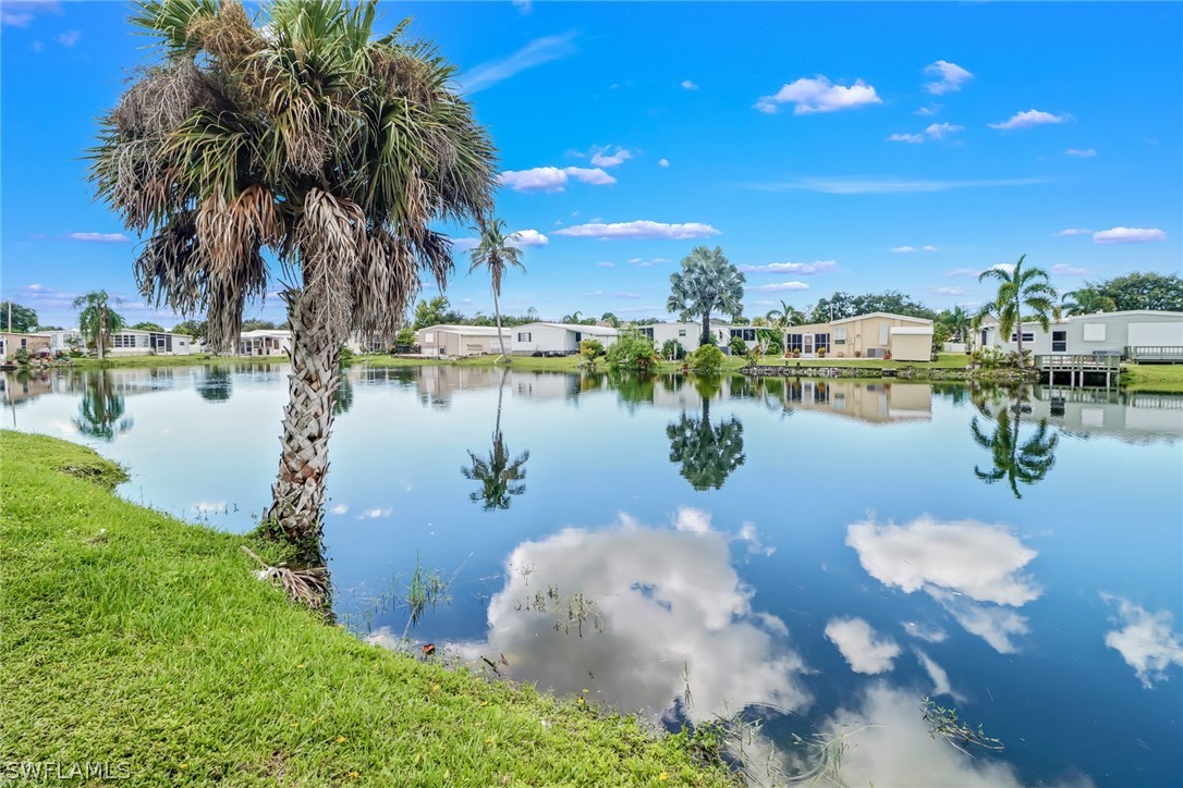 153 Cape Sable Drive Naples, FL 34104 - Photo 4 of 35 a view of a lake with outdoor space