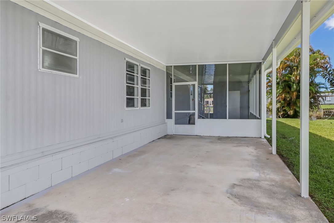153 Cape Sable Drive Naples, FL 34104 - Photo 5 of 35 a view of an empty room with a window