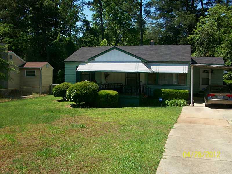 4208 Hanes Drive Decatur, GA 30035 - Photo 1 of 1 Exterior Front. SPACIOUS FENCED YARD W/ VIEW OF CARPORT
