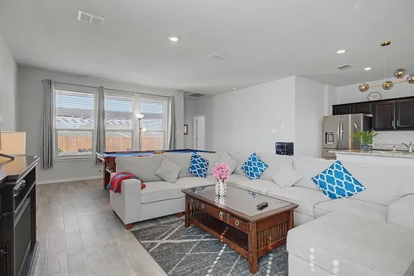 a living room with furniture and a table