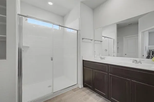 a bathroom with a double vanity sink mirror and double