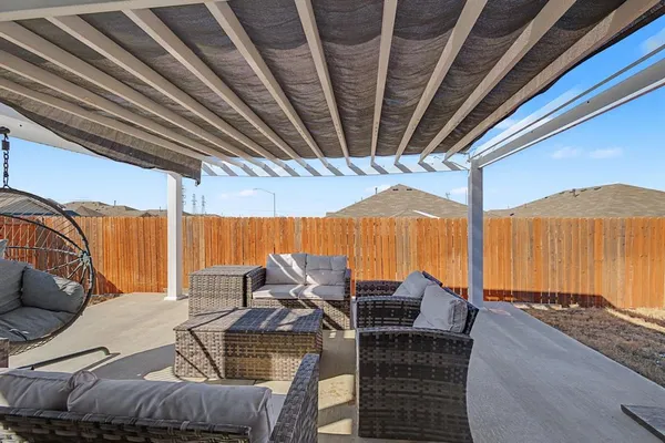 a view of balcony with furniture