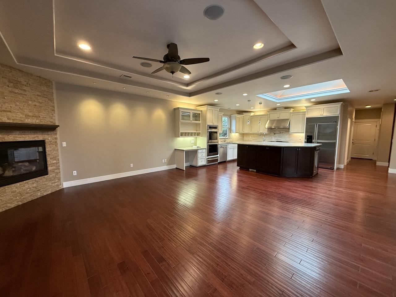 94 Harold Avenue Santa Clara, CA 95050 - Photo 12 of 34 an empty room with wooden floor and windows