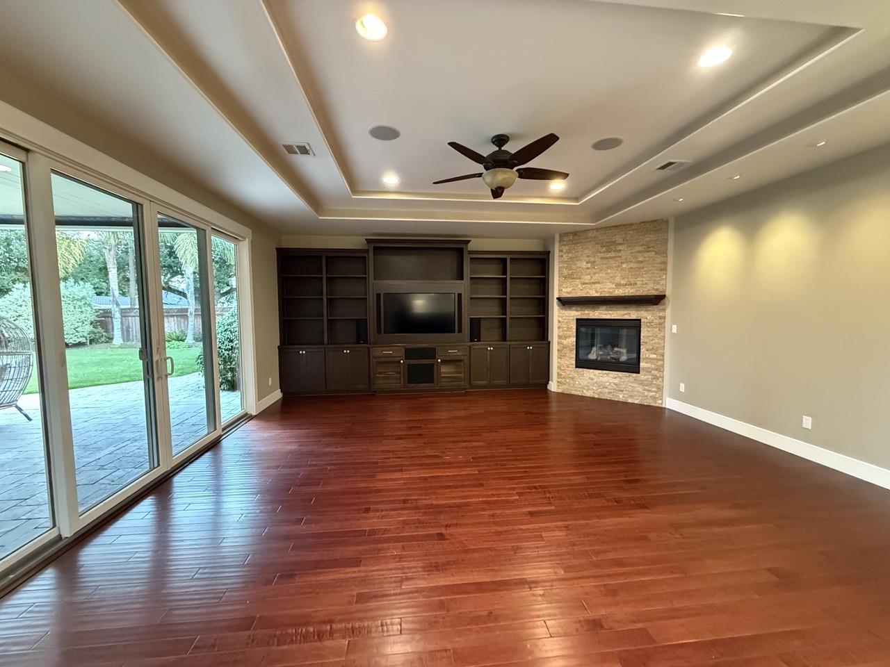 94 Harold Avenue Santa Clara, CA 95050 - Photo 13 of 34 wooden floor in an empty room with a fireplace
