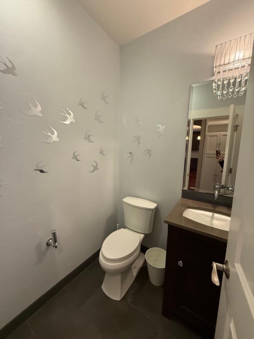 94 Harold Avenue Santa Clara, CA 95050 - Photo 17 of 34 a white toilet sitting next to a bathroom sink and vanity