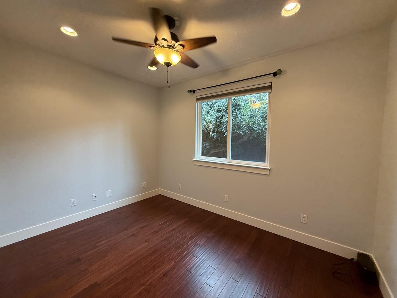 94 Harold Avenue Santa Clara, CA 95050 - Photo 18 of 34 a view of an empty room with wooden floor and a window