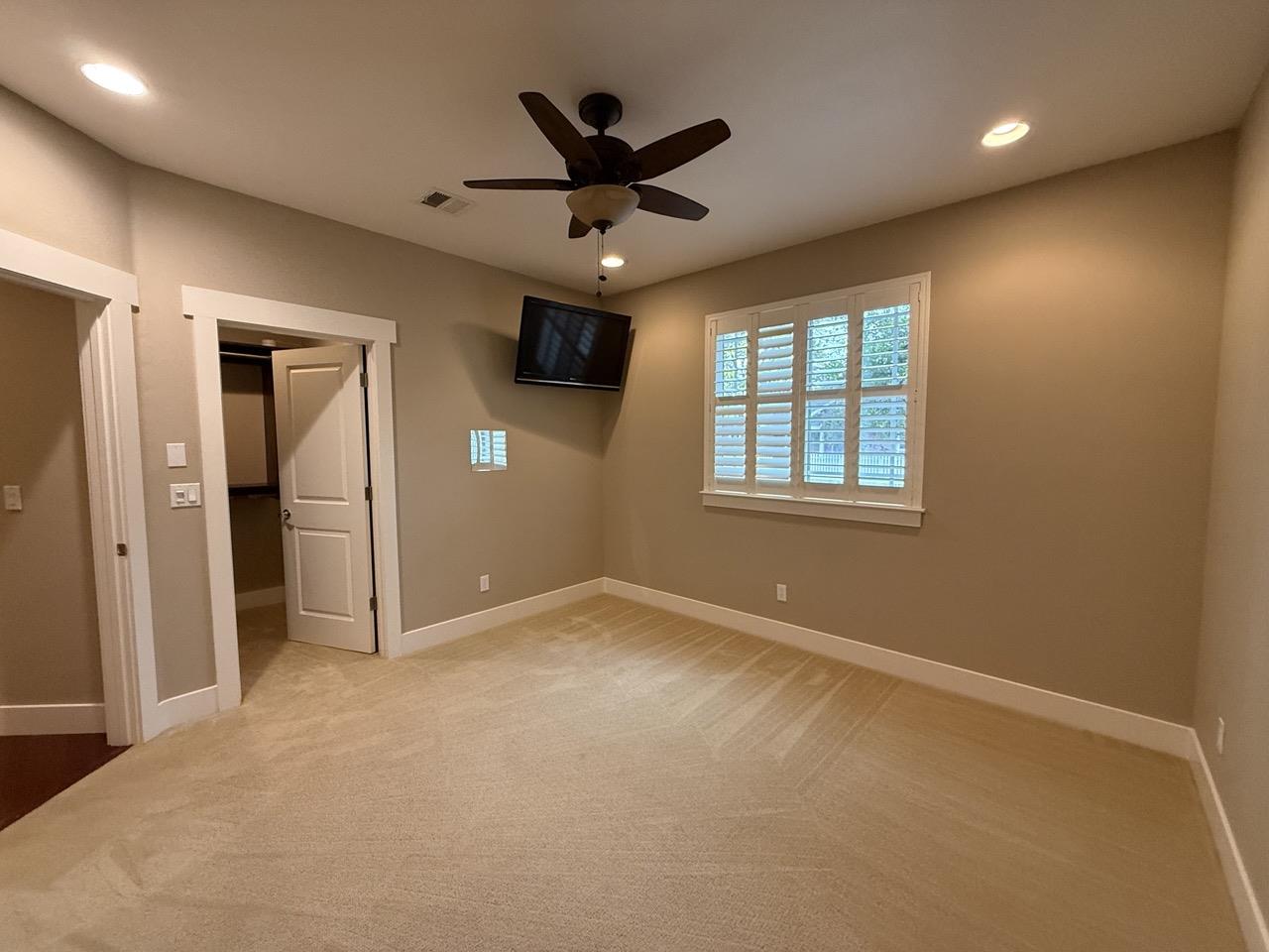 94 Harold Avenue Santa Clara, CA 95050 - Photo 24 of 34 an empty room with ceiling fan and windows