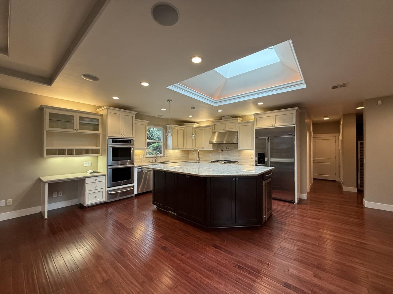 94 Harold Avenue Santa Clara, CA 95050 - Photo 10 of 34 a view of kitchen with stainless steel appliances wooden floor and living room