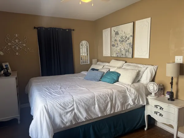 a bedroom with a bed and a window