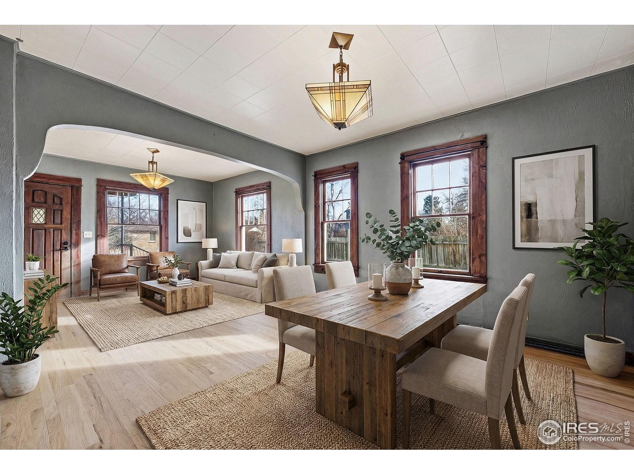 4635 Teller Street Wheat Ridge, CO 80033 - Photo 11 of 36 a view of a dining room with furniture window and wooden floor