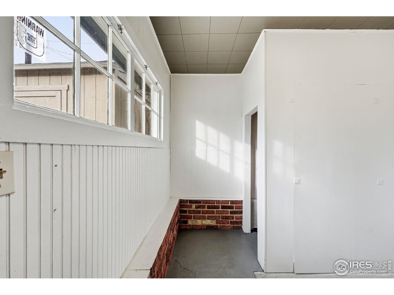4635 Teller Street Wheat Ridge, CO 80033 - Photo 17 of 36 a view of an empty room with a window