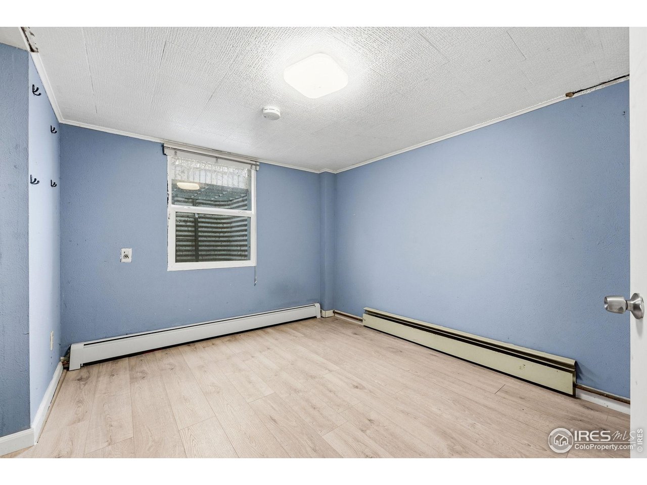 4635 Teller Street Wheat Ridge, CO 80033 - Photo 28 of 36 an empty room with windows