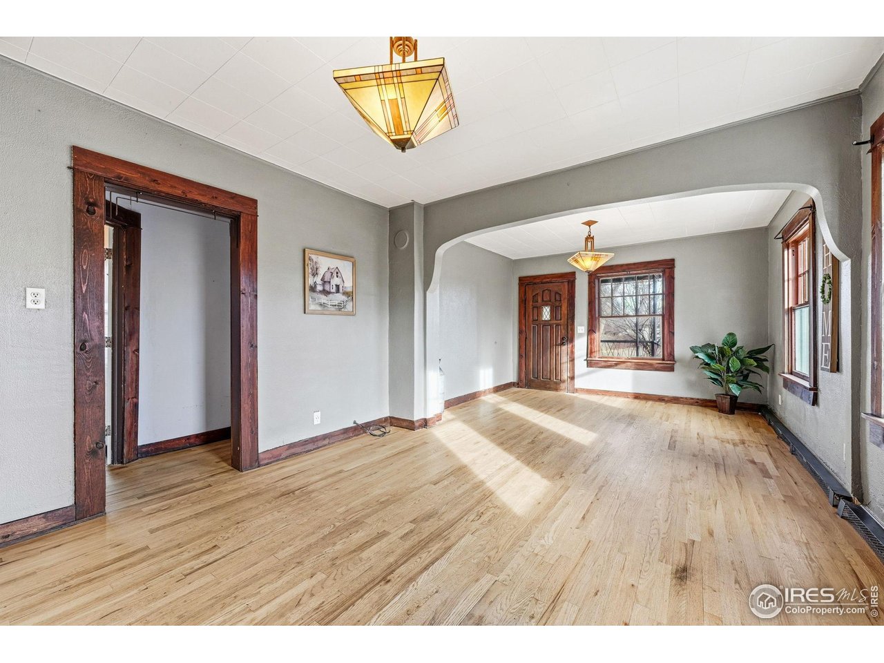 4635 Teller Street Wheat Ridge, CO 80033 - Photo 10 of 36 wooden floor in a hall with an entryway