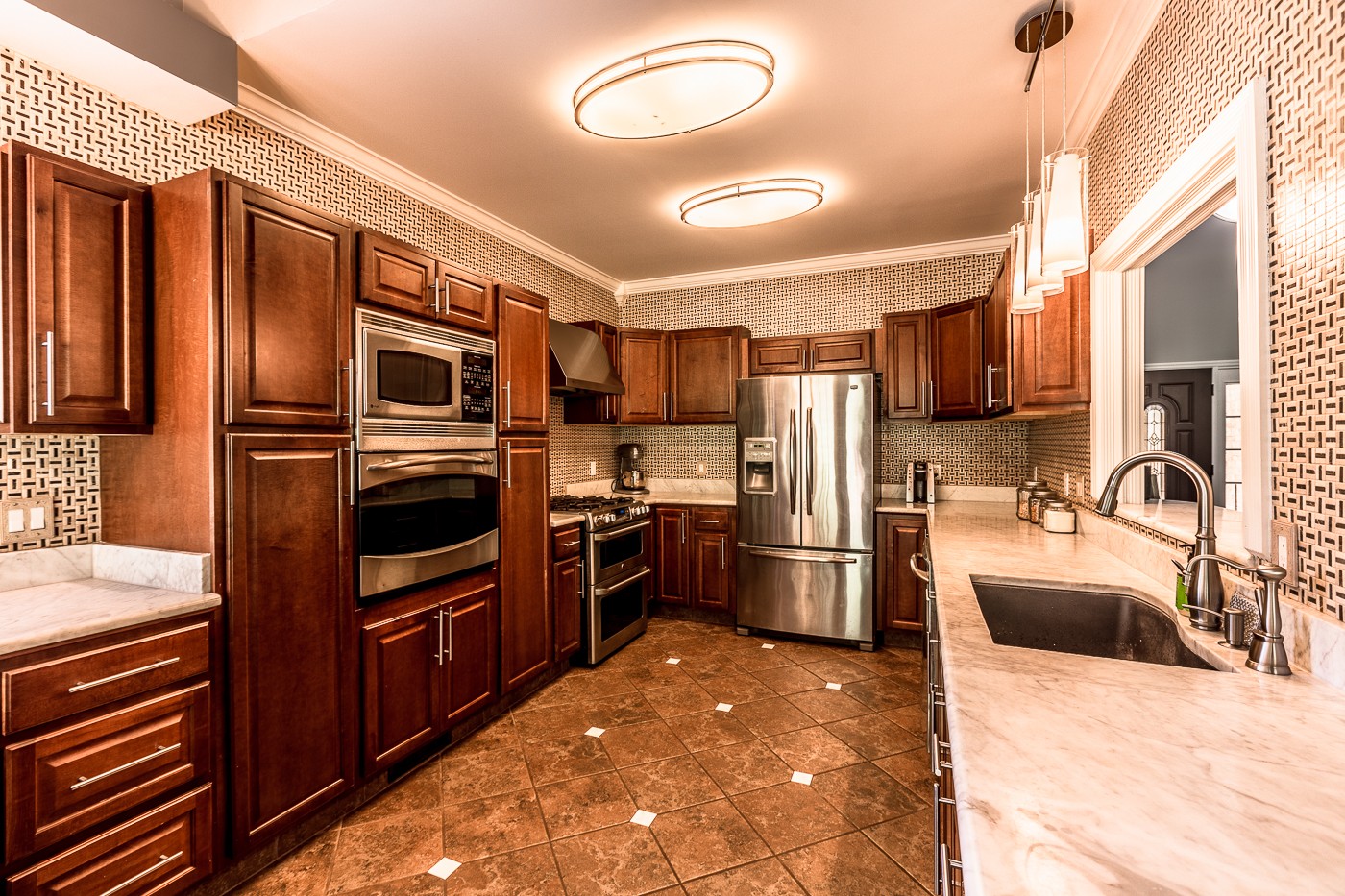 1838 O'Reilly Circle Spring Hill, TN 37174 - Photo 14 of 36 a kitchen with granite countertop a refrigerator stove and sink
