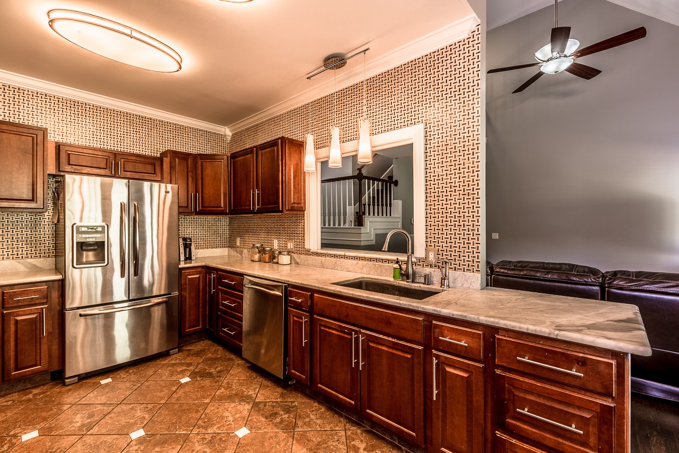 1838 O'Reilly Circle Spring Hill, TN 37174 - Photo 15 of 36 a kitchen with stainless steel appliances granite countertop a sink stove and refrigerator