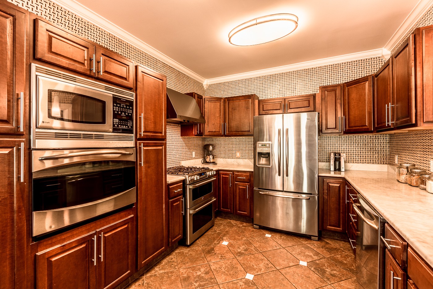 1838 O'Reilly Circle Spring Hill, TN 37174 - Photo 16 of 36 a kitchen with stainless steel appliances granite countertop a refrigerator stove and sink