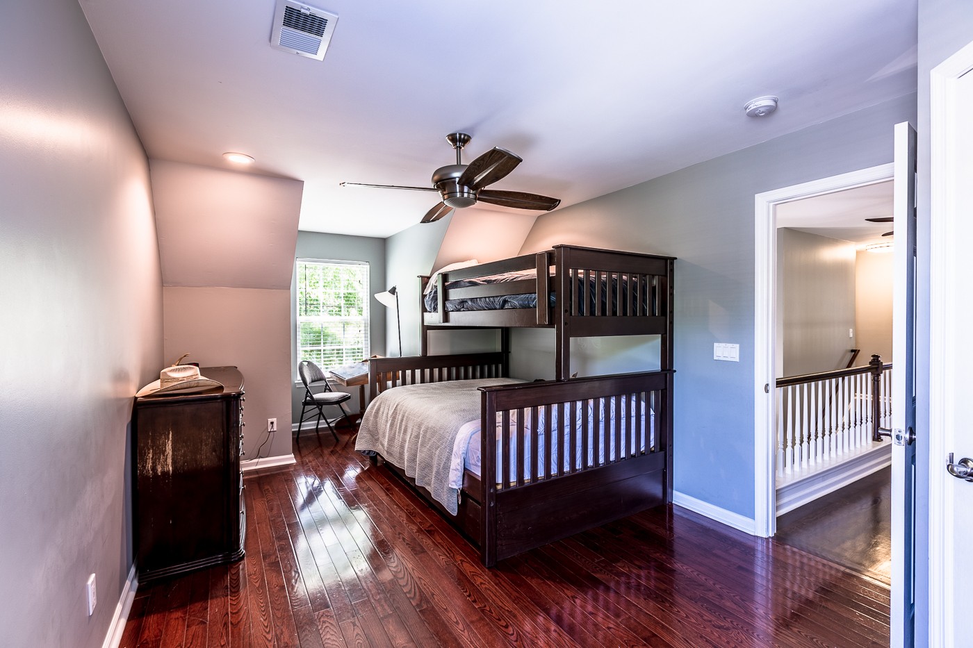 1838 O'Reilly Circle Spring Hill, TN 37174 - Photo 29 of 36 a bedroom with a bed and wooden floor