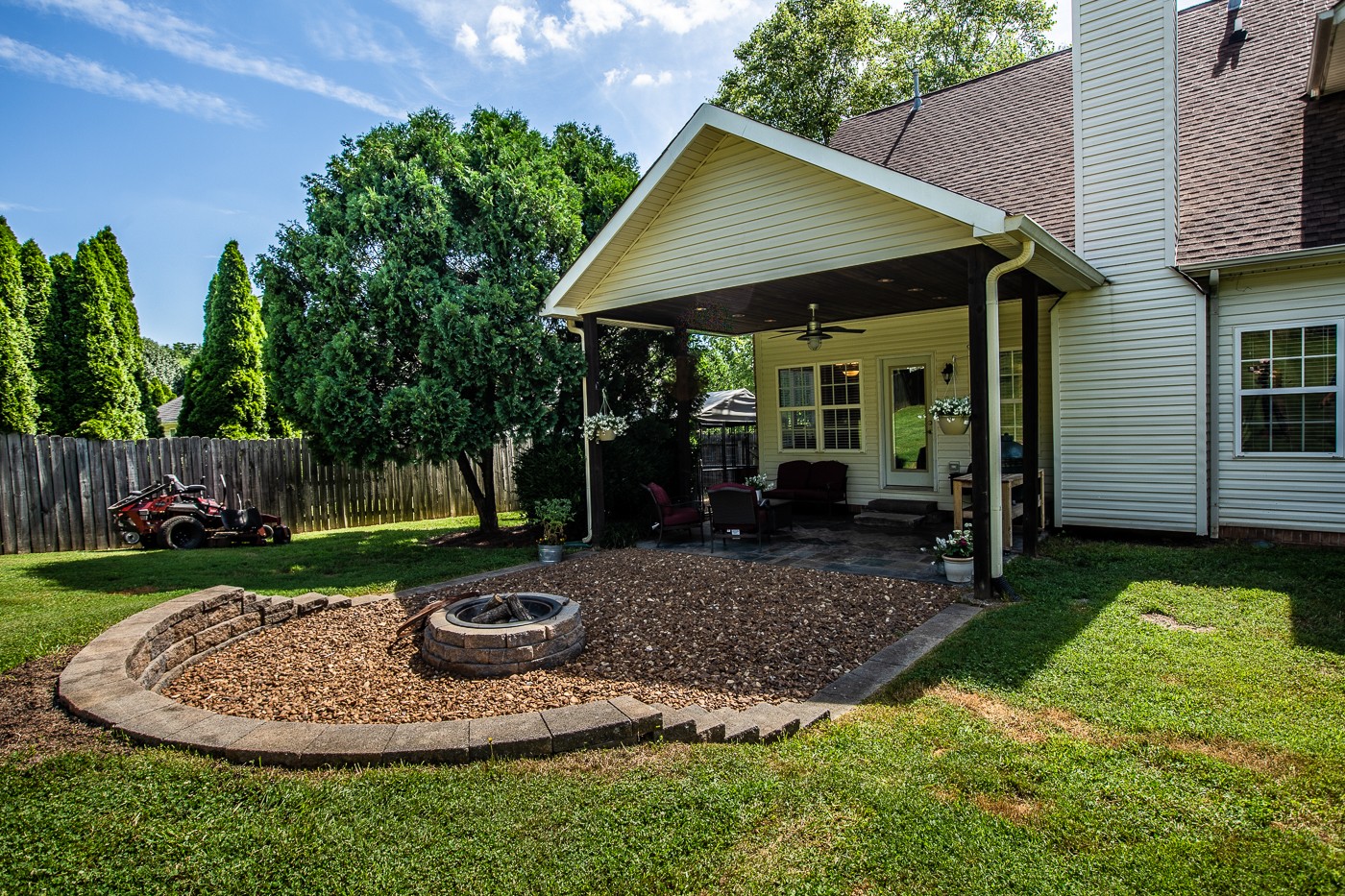 1838 O'Reilly Circle Spring Hill, TN 37174 - Photo 4 of 36 a view of a backyard with table and chairs potted plants and large tree