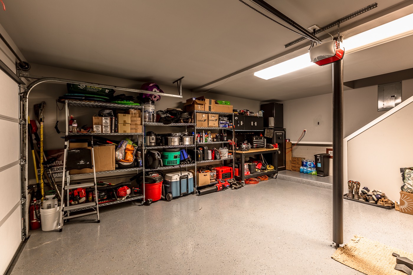 1838 O'Reilly Circle Spring Hill, TN 37174 - Photo 35 of 36 a view of a garage with storage and a white car parked