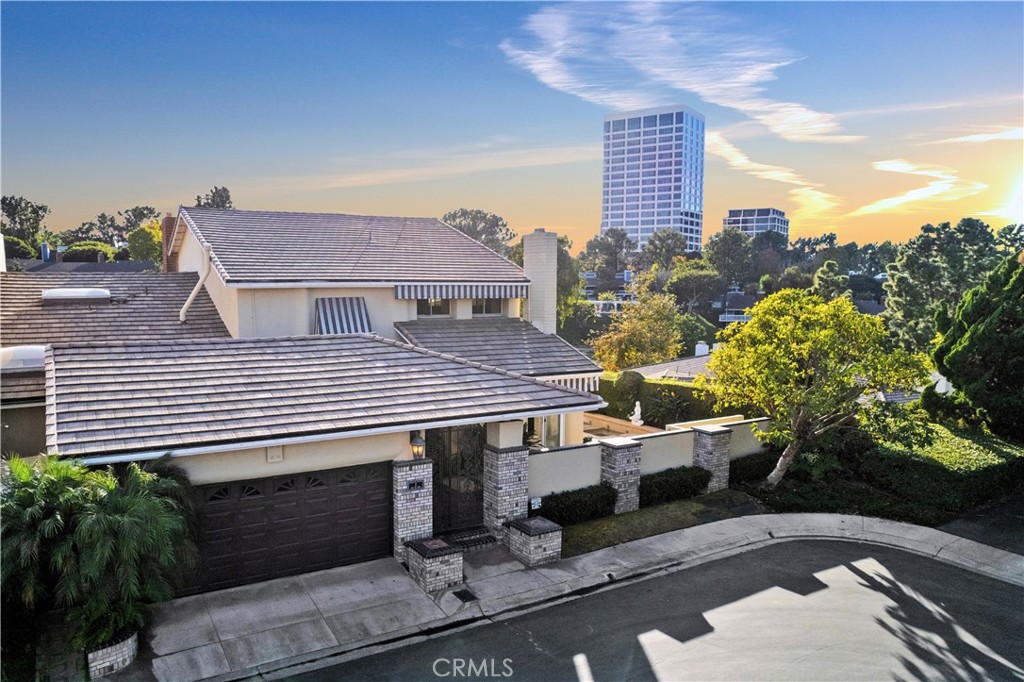 1 Rue Du Parc Newport Beach, CA 92660 - Photo 1 of 49 a aerial view of a house with a garden and plants