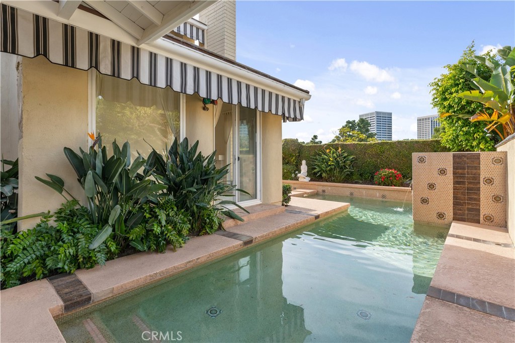 1 Rue Du Parc Newport Beach, CA 92660 - Photo 15 of 49 a view of swimming pool with lawn chairs and plants