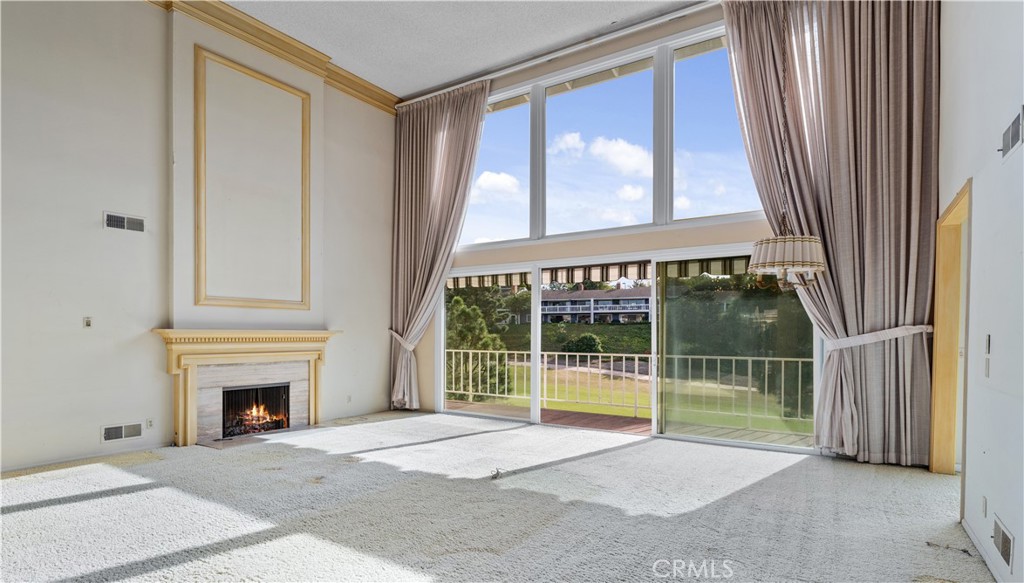 1 Rue Du Parc Newport Beach, CA 92660 - Photo 22 of 49 a view of an empty room with a fireplace and a window