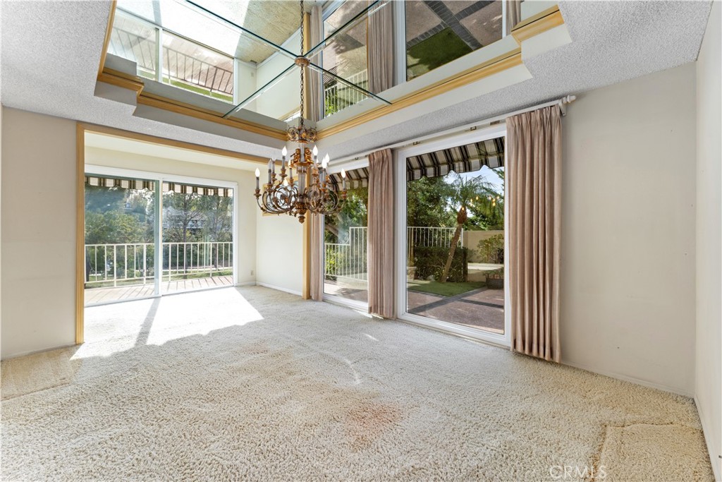 1 Rue Du Parc Newport Beach, CA 92660 - Photo 25 of 49 a view of an empty room with a windows and a ceiling fan