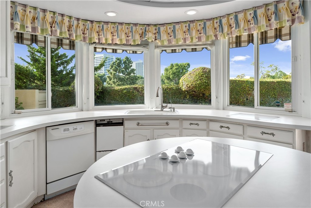 1 Rue Du Parc Newport Beach, CA 92660 - Photo 30 of 49 a kitchen with a sink and a large window