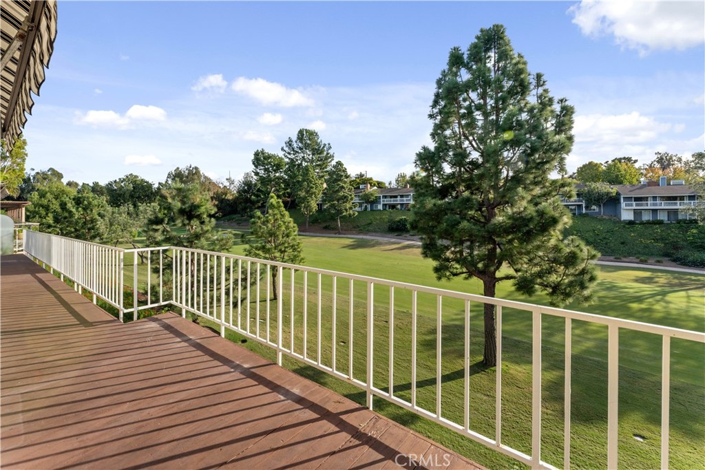 1 Rue Du Parc Newport Beach, CA 92660 - Photo 3 of 49 a view of a balcony with wooden floor and fence
