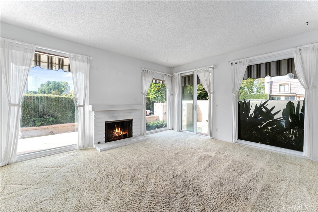 1 Rue Du Parc Newport Beach, CA 92660 - Photo 32 of 49 a view of a livingroom with an empty space and a fireplace
