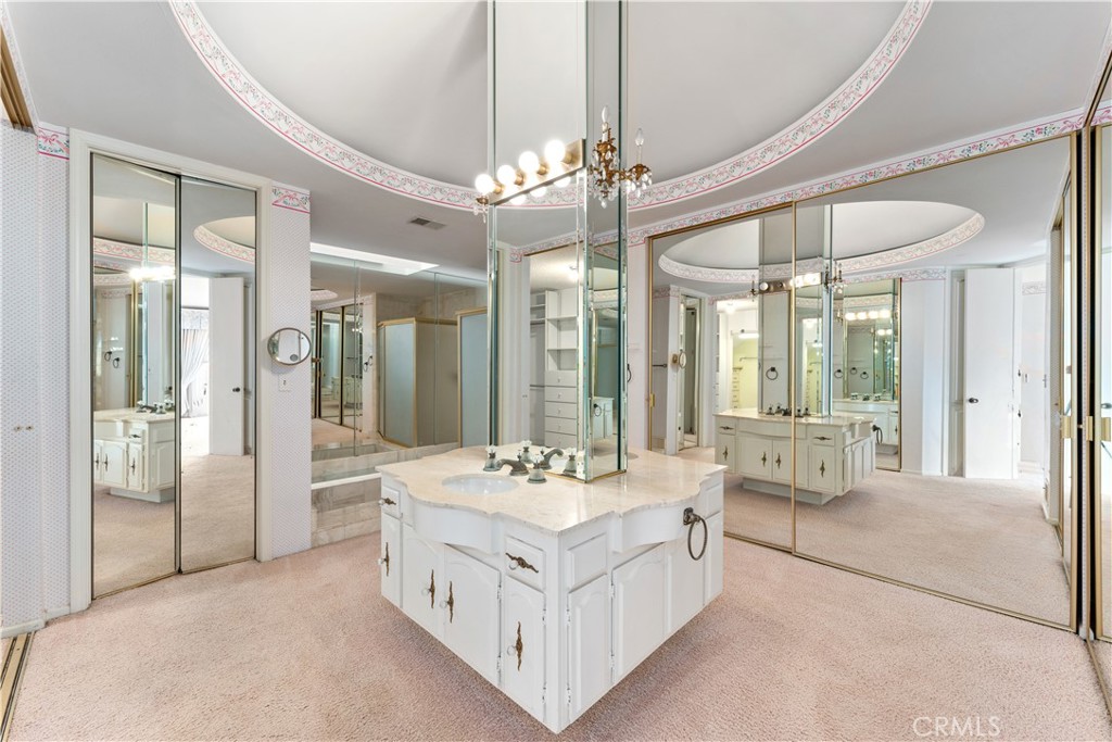 1 Rue Du Parc Newport Beach, CA 92660 - Photo 35 of 49 a bathroom with a double vanity sink large mirror and a shower