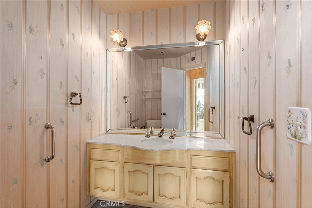 1 Rue Du Parc Newport Beach, CA 92660 - Photo 36 of 49 a bathroom with a sink vanity and mirror