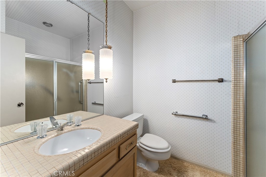 1 Rue Du Parc Newport Beach, CA 92660 - Photo 38 of 49 a bathroom with a sink toilet and shower