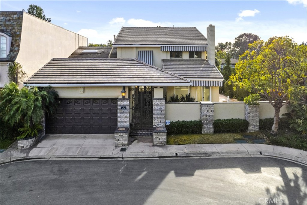 1 Rue Du Parc Newport Beach, CA 92660 - Photo 43 of 49 front view of a house with potted plants