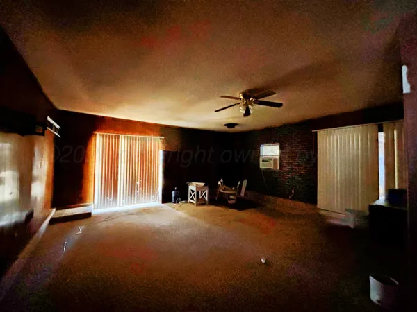 a view of a livingroom with furniture window and outside view