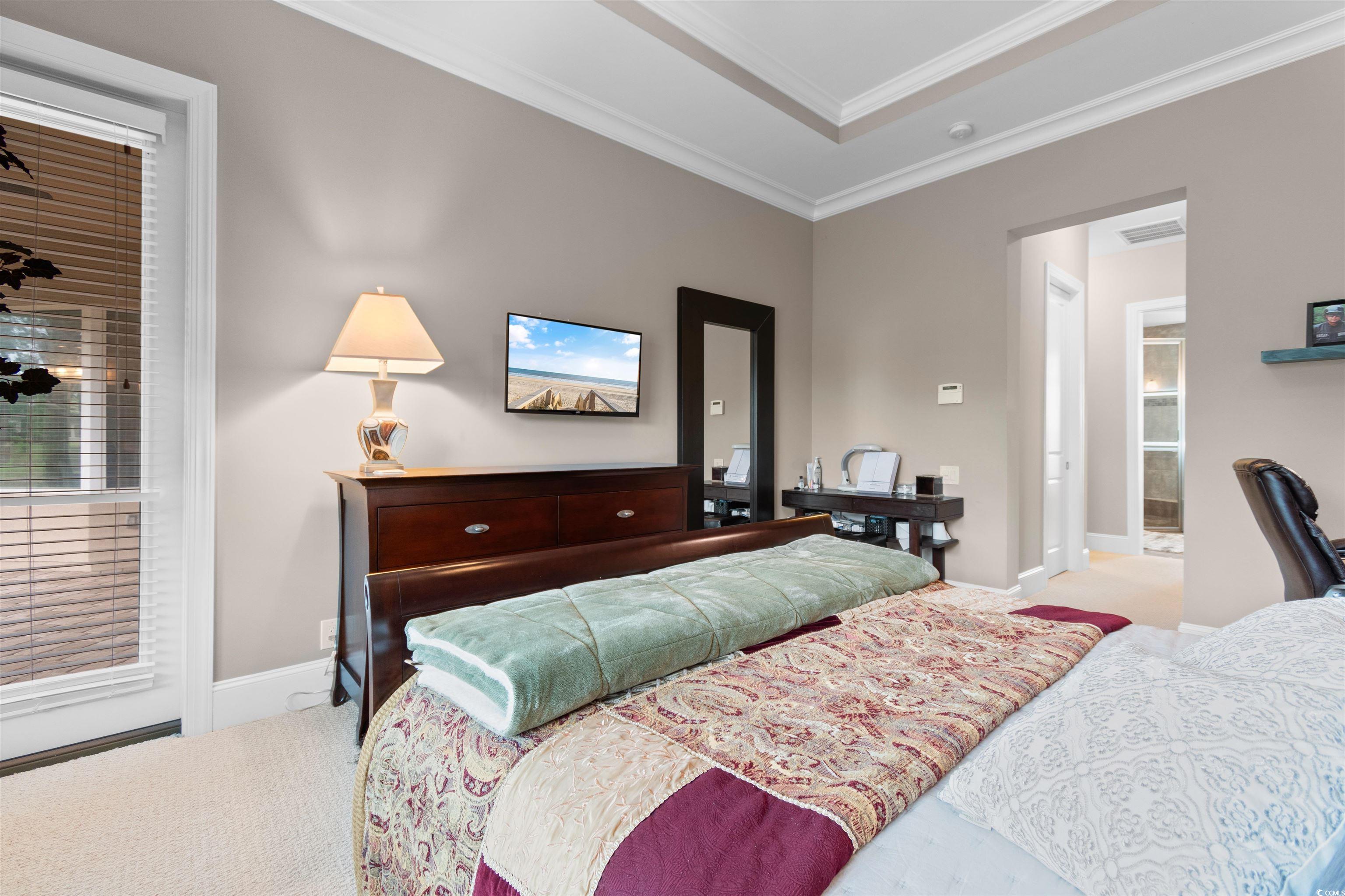 7253 Seville Drive Myrtle Beach, SC 29572 - Photo 18 of 39 Bedroom with carpet, ornamental molding, a desk, and baseboards
