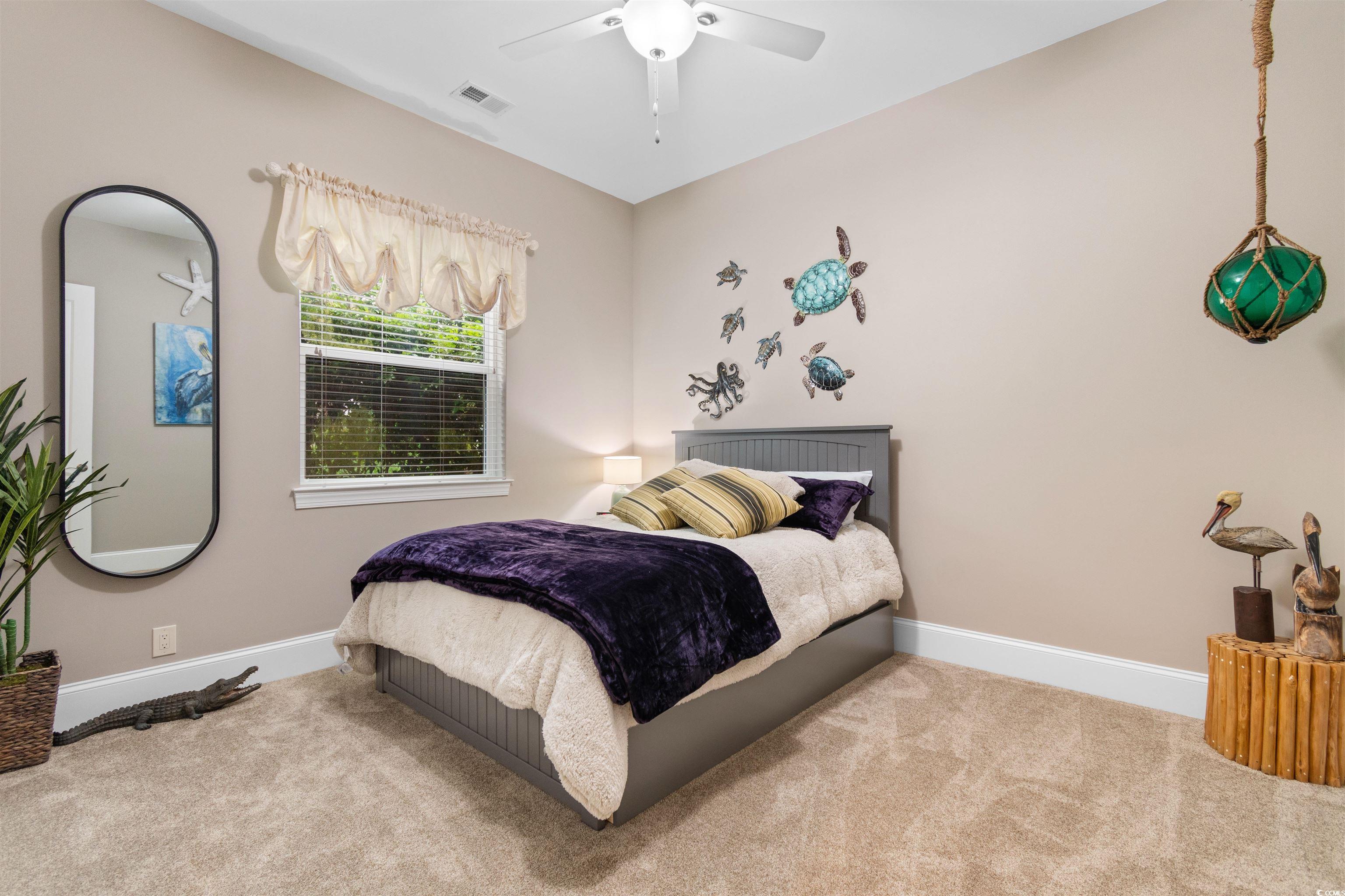 7253 Seville Drive Myrtle Beach, SC 29572 - Photo 24 of 39 Carpeted bedroom with baseboards and a ceiling fan