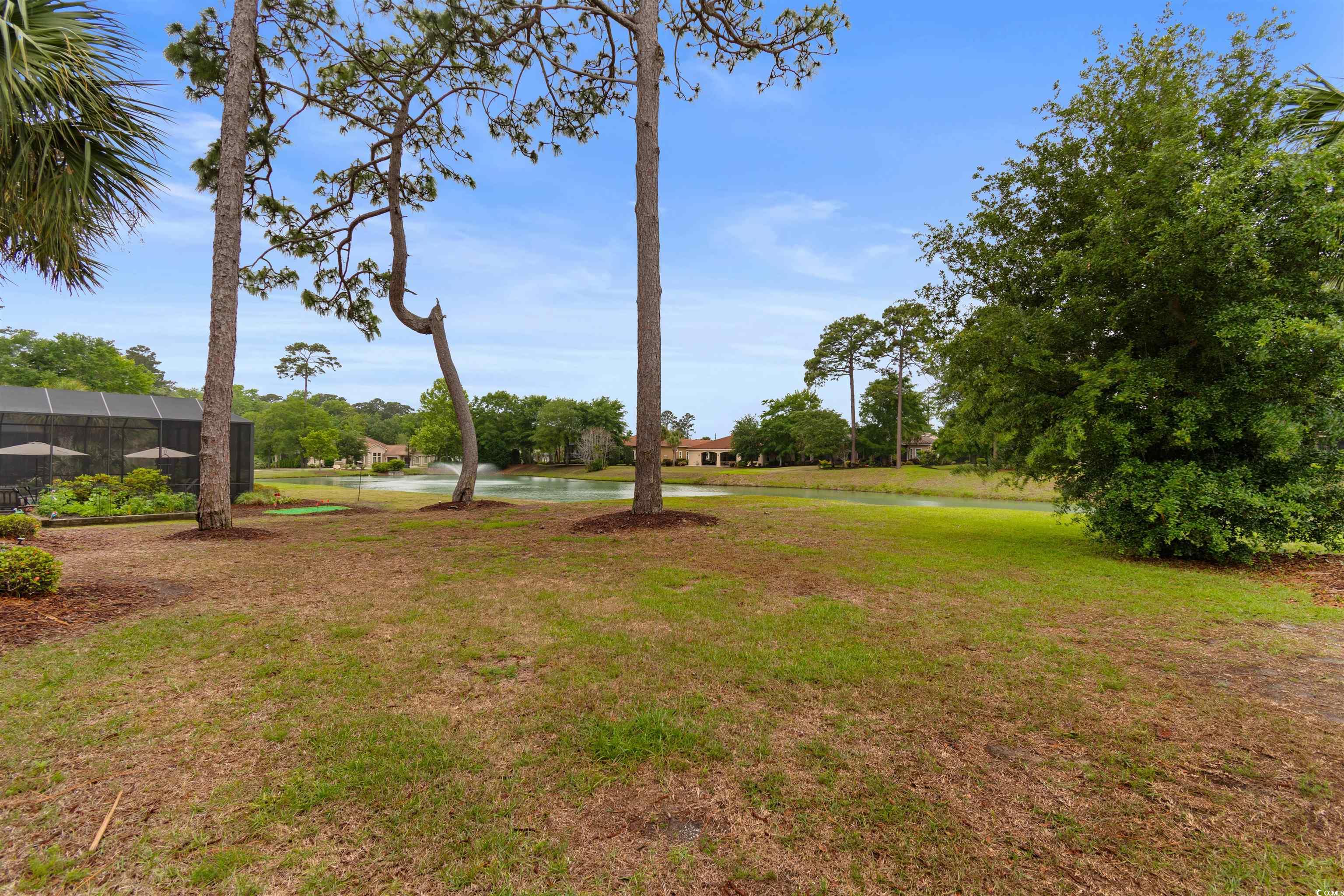 7253 Seville Drive Myrtle Beach, SC 29572 - Photo 33 of 39 View of grassy yard featuring a water view