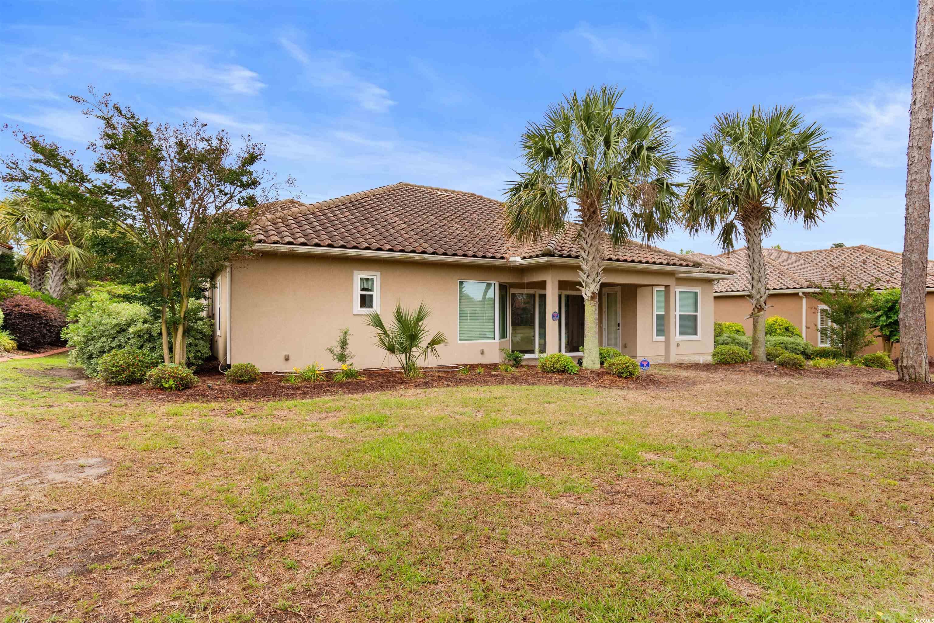 7253 Seville Drive Myrtle Beach, SC 29572 - Photo 35 of 39 View of Back yard, and a tiled roof