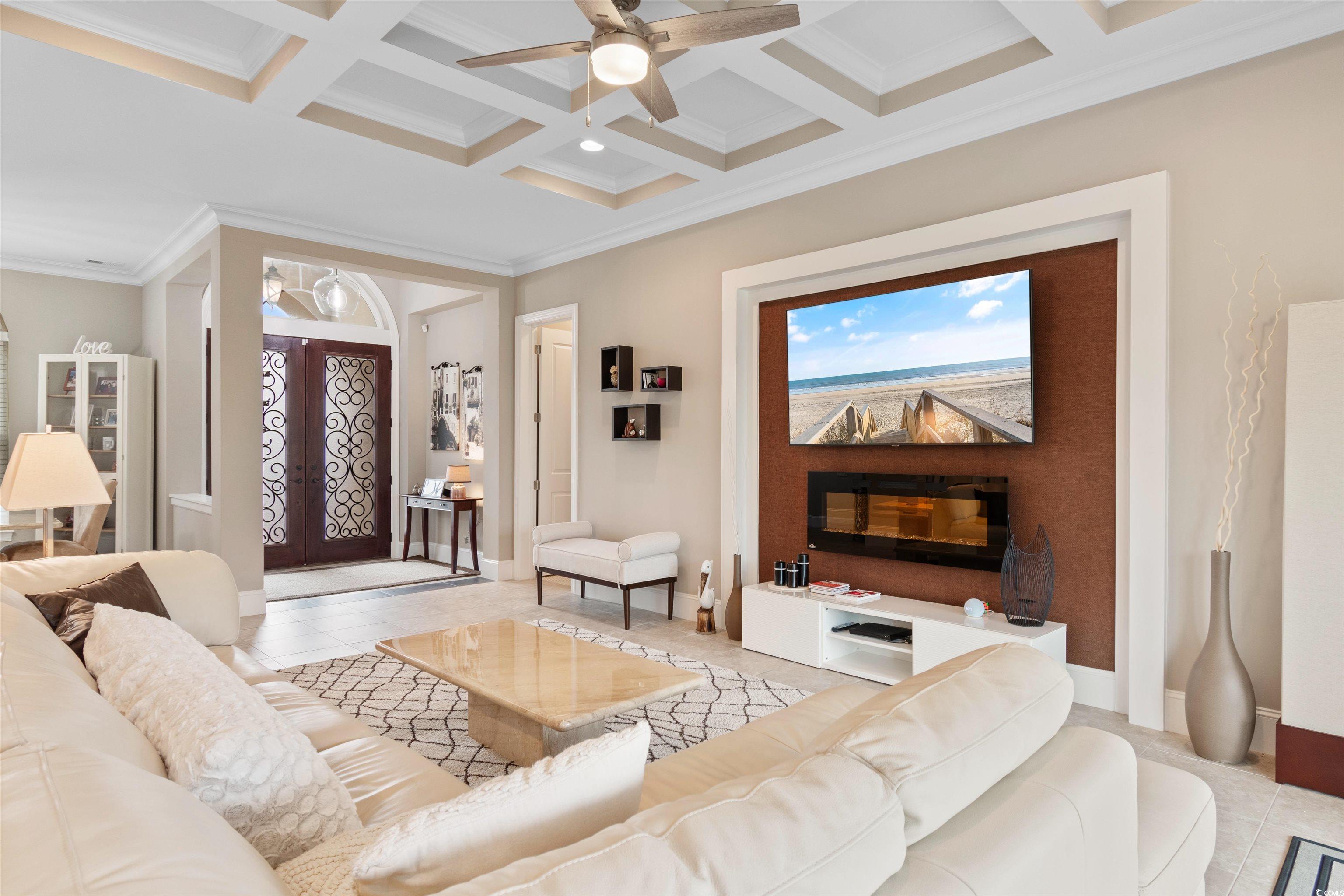 7253 Seville Drive Myrtle Beach, SC 29572 - Photo 8 of 39 Living area with ornamental molding, a ceiling fan, beamed ceiling, coffered ceiling, and baseboards