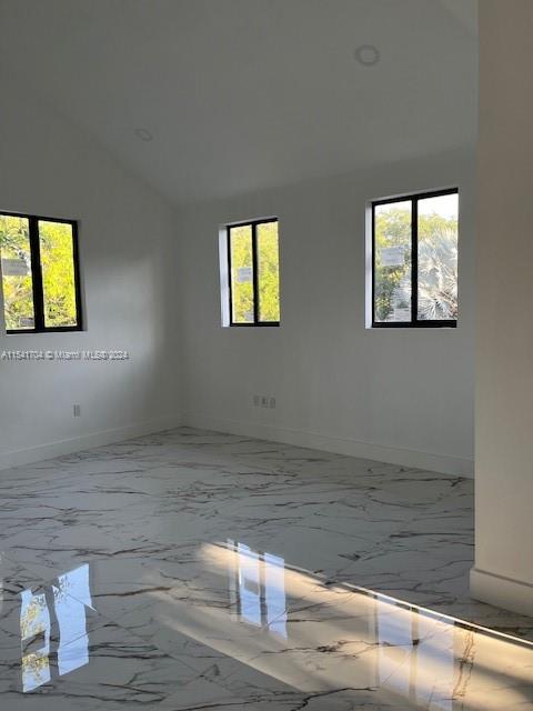5455 Southwest 60th Court Miami, FL 33155 - Photo 25 of 68 a view of an empty room with wooden floor and a window